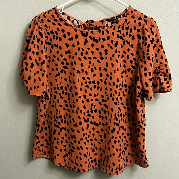 Orange printed shortsleeved blouse with back tie - Picture 1 of 3